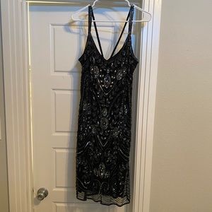 Beaded, black cocktail dress.